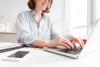 brunette-woman-typing-email-laptop-computer-while-sitting-home-selective-focus-hand shutterstock 761044828
